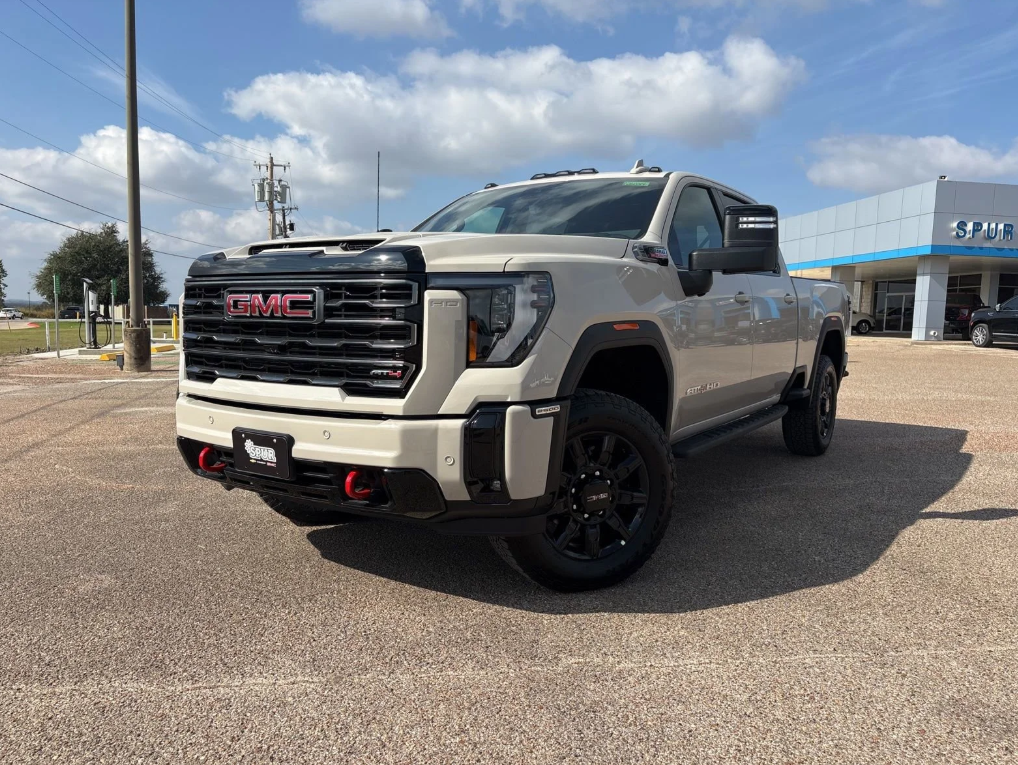 2026 GMC Sierra 2500HD with a strong front stance, displayed outside Spur Chevrolet GMC in Gatesville, TX